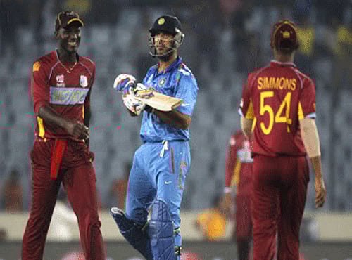 India's Yuvraj Singh  leaves the field as West Indies fielders celebrate his dismissal during their ICC Twenty20 World Cup match, Reuters photo