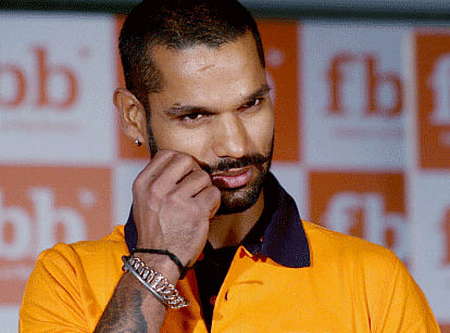 Indian cricketer Shikhar Dhawan has been captured in a suave and intense look for the cover of men's fashion magazine GQ India, in which he has spoken about life, childhood hijinks and his inkings. AP photo
