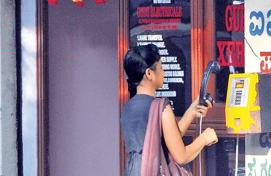 In the age of affordable mobile phones, public telephone booths are fast disappearing from the City. DH photo