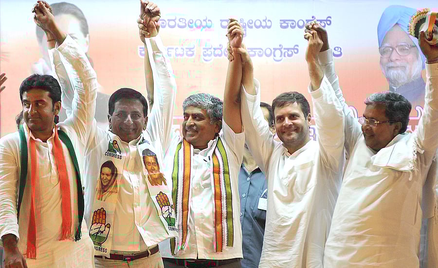 Congress candidates for Lok Sabha constituencies in Bangalore Rizwan Arshad (B'lore Central), C Narayana Swamy (B'lore North) and Nandan Nilekani (B'lore South) with AICC vice-president Rahul Gandhi and chief minister Siddaramaiah in Bangalore on Monday. DH Photo/ Srikanta Sharma R.