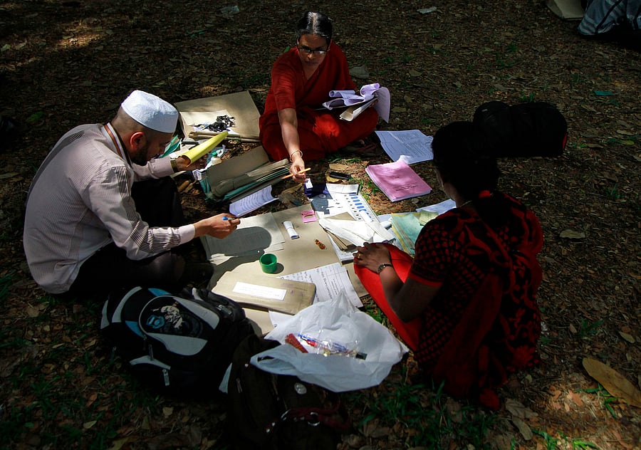 Polling officials sort stationery and other documents collected from a distribution centre ahead of the second phase of the general election at Kochi city. Reuters Image