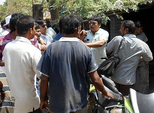 Trinamool Congress supporters attack Election Commission officials in Manikchak area under South Malda constituency of West Bengal on Thursday. PTI photo