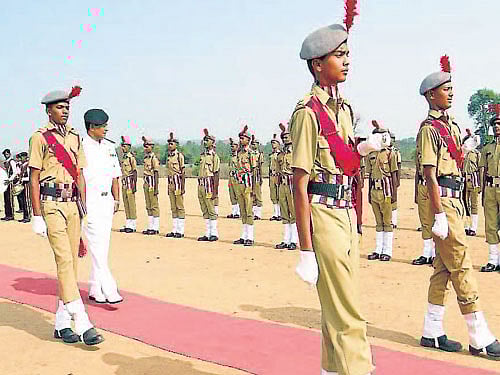 Indian Naval Academy, Ezhimala Commandant Vice Admiral Ajit Kumar P receives guard of honour from cadets of Sainik School. DH photo