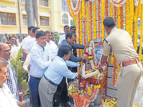 Deputy Commissioner B S Shekharappa garlands the portrait of B R Ambedkar on the occasion of 123rd AmbedkarJayanthi celebrations in Chikmagalur. DH Photo