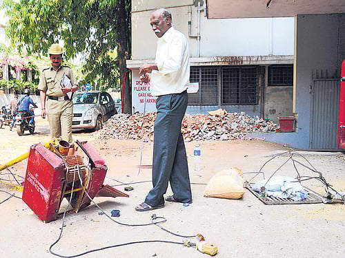The broken parts of a temporary lift in a commercial building on Lavelle Road, that crashed and led to the death of foreman Subramani on Monday. DH Photo