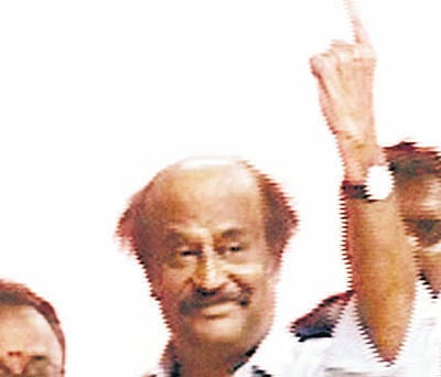 Actor Rajinikanth shows his inked finger after casting his vote for the Lok Sabha elections, in Chennai on Thursday. PTI PhotoTV Grab