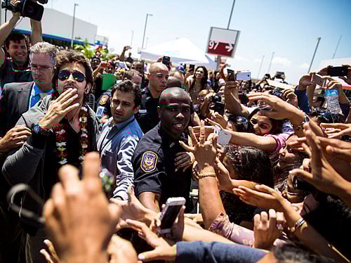 Hrithik Roshan greets fans and well-wishers after arriving on the green carpet on the ninth floor of the parking garage at Tampa International Airport for the 15th IIFA Awards on Thursday, April 24, 2014 in Tampa, Florida. AP