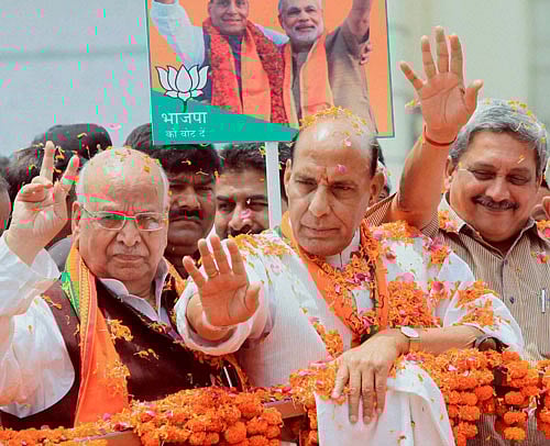 BJP President and Lucknow lok sabha seat candidate Rajnath Singh during roadshow in Lucknow on Sunday.PTI Photo