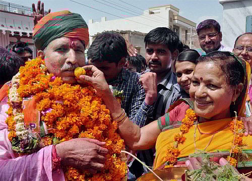 BJP candidate Arjun Ram Meghwal is greeted by family members after his victory in Lok Sabha elections, in Bikaner on Friday. PTI Photo