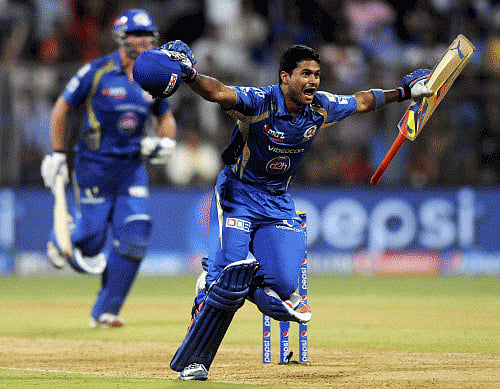 Aditya Tare of the Mumbai Indians celebrates after hitting the winning run during an IPL 7 against Rajasthan Royals in Mumbai on Sunday. PTI Photo