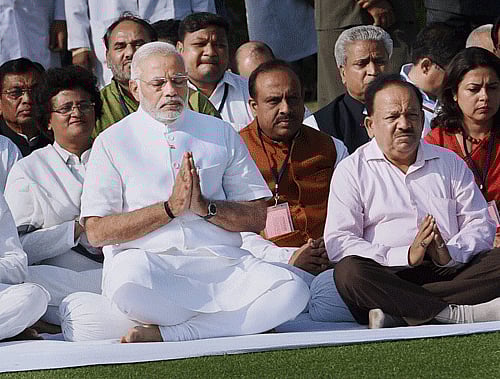 Prime Minister-designate Narendra Modi prays at Rajghat, the memorial of Mahatma Gandhi, in New Delhi on Monday.PTI Photo
