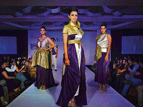 Models display creations by students of  Mod'Art International. DHNS