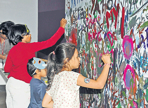 enjoying:  Kids having fun with paint.