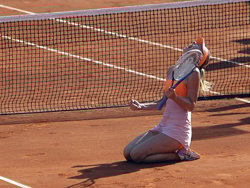 Maria Sharapova is overcome by emotion after her victory in the French Open final against Simona Halep in Paris on Saturday. AP photo