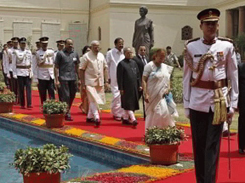 President Pranab Mukherjee arrives along with Prime Minister Narendra Modi and Lok Sabha speaker Sumitra Mahajan, to address the joint session of the parliament in New Delhi. Reuters photo