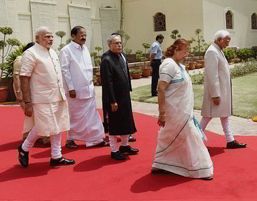 resident Pranab Mukherjee, accompanied by Vice President and Rajya Sabha Chairman Hamid Ansari, Prime Minister Narendra Modi, Lok Sabha Speaker Sumitra Mahajan and Parliamentary Affairs Minister M Venkaiah Naidu, proceeds to Central Hall to address the joint session of Parliament in New Delhi on Monday. PTI Photo
