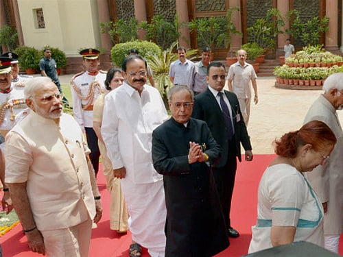 President Pranab Mukherjee, accompanied by Vice President and Chairman of Rajya Sabha Hamid Ansari, Prime Minister Narendra Modi, Lok Sabha Speaker Sumitra Mahajan and Parliamentary Affairs Minister M Venkaiah Naidu, proceeds to Central Hall to address the joint session of Parliament in New Delhi. PTI Photo