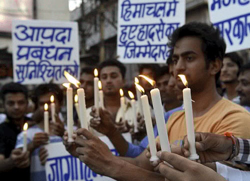 Students take part in candle light protest against the Himachal Pradesh Government in connection with Beas River tragedy, in Bhopal on Tuesday. PTI Photo