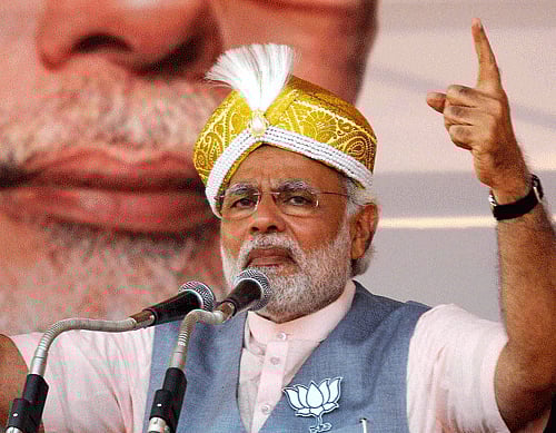 Dressed in his trademark kurta churidar and a blue waist coat, a smiling Modi waved his naval cap from the cockpit during his several minute long stint in the pilot's seat of one of India's most advanced fighter jet. PTI file photo