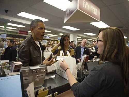 U.S. President Barack Obama shops with daughter Malia at Politics and Prose Bookstore and Coffeehouse in Washington. Reuters file photo