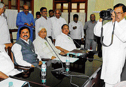 IN FOCUS: KPCC president G Parameshwara tries his hand at taking pictures at the Congress Legislature Party meeting, which mostly focused on the party's defeat in the Lok Sabha  elections, in Bangalore on Wednesday. dh photo