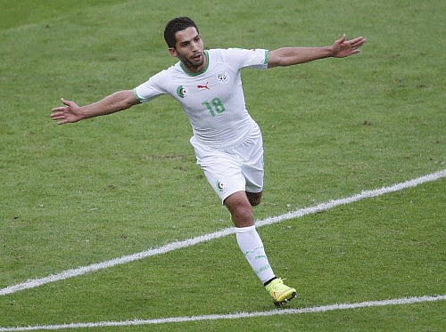 Algeria's Abdelmoumene Djabou celebrates scoring his team's third goal against South Korea during their 2014 World Cup Group H soccer match at the Beira Rio stadium in Porto Alegre June 22, 2014.  Reuters photo