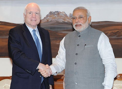 Prime Minister Narendra Modi with US Senator, John McCain in New Delhi on Thursday. PTI