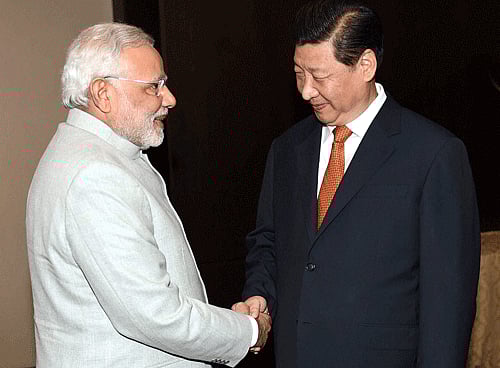 Prime Minister Narendra Modi with President of China Xi Jinping during the bilateral meeting in Fortaleza in Brazil on Monday. PTI Photo