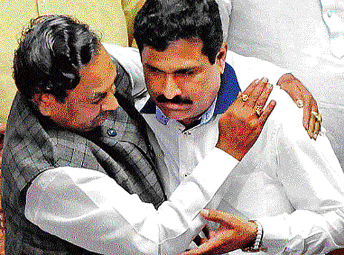 Leader of Opposition K S Eshwarappa hugs JD(S) leader Puttanna after the latter was officially declared the deputy chairman of the Legislative Council on Tuesday. dh Photo