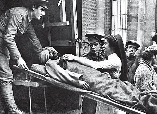 An Indian soldier wounded in World War I being attended to.