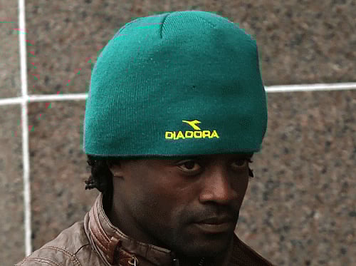 Australian Commonwealth Games weightlifter Francois Etoundi departs Glasgow court after being ordered to pay compensation to a Welsh athlete after he admitted headbutting him Thursday July 31, 2014. AP Photo