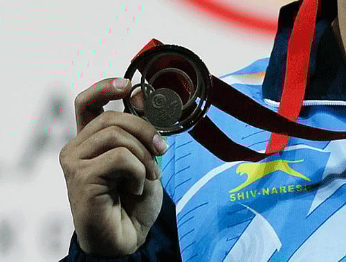 Indian powerlifter Sakina Khatun won the bronze in the women's lightweight category to give the country its first medal of day 10 of the 2014 Commonwealth Games here Saturday. Ap file photo