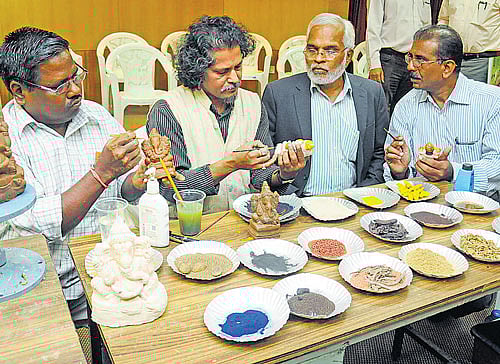 Close to nature: Karnataka State Pollution Control Board chairman Vaman Acharya  (second from right) looks at the  eco-friendly Ganesha idols being created at a workshop organised in the City on Tuesday. dh Photo