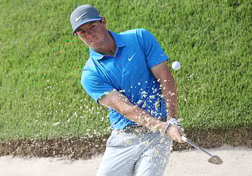 PGA golfer Rory McIlroy hits out of a sand trap on the 14th hole during the third round of the 2014 PGA Championship golf tournament at Valhalla Golf Club. Reuters