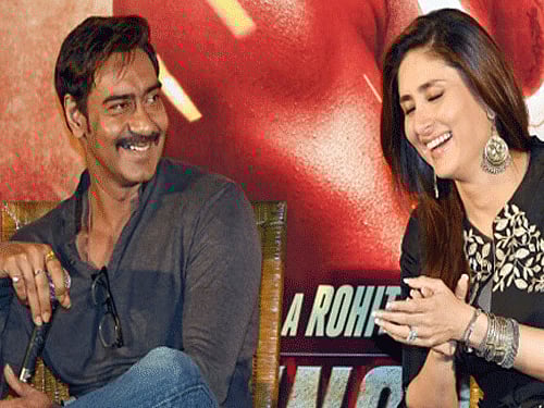 Bollywood actress Ajay Devgn and Kareena Kapoor Khan during promotion of Singham Returns in Kolkata on Sunday. PTI Photo
