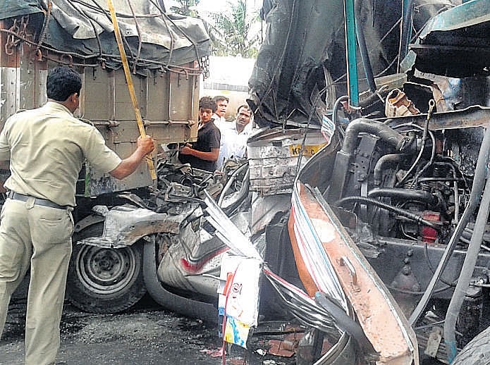 The mangled remains of the vehicles that were involved in a serial accident near Veerasandra industrial estate on Hosur Road on Tuesday. One person was killed and four others injured in a pile-up involving a mini goods vehicle, a van, four cars and two bikes. DH photo
