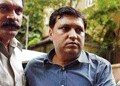 CBI officials produce Central Board of Film Certification  CEO Rakesh Kumar in the  Sessions Court in an bribery case in Mumbai on Tuesday. PTI photo