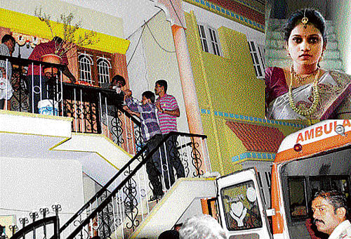 cruel end: Police shift the body of Parijatha (inset) from her home at Goraguntepalya on Tuesday. dh Photo