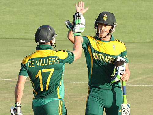 South African player Faf du Plessis, right, celebrates with AB de Villiers after scoring 100 runs during the cricket One Day International match against Australia in Harare Zimbabwe Wednesday, Aug. 27, 2014. The two teams are in Zimbabwe for a triangular ODI series with Zimbabwe. AP Photo