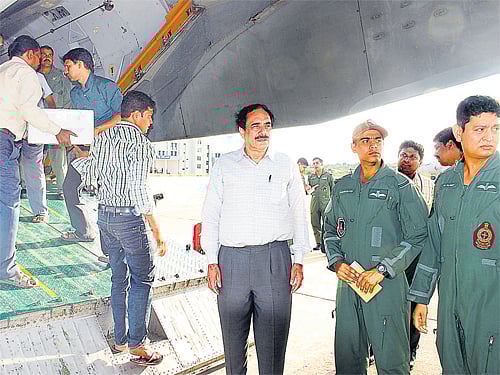 Director of Defence Food Research Laboratory Harsh Vardhan Batra with the first consignment of food items bound for Kashmir, at the Mysore Airport, on Tuesday.