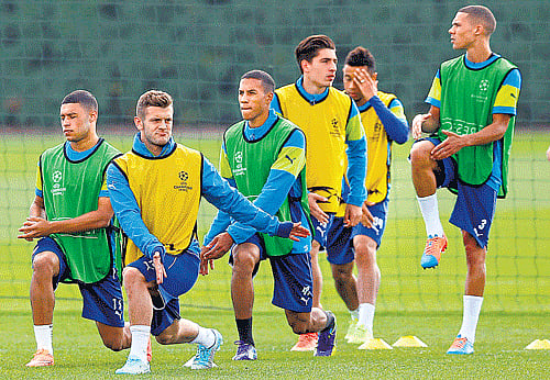 Arsenal players train on the eve of their Champions League clash against Borussia Dortmund. AP