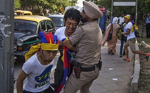Scores of Tibetans staged a protest this morning outside Hotel Taj Palace where Chinese President Xi Jinping and his wife are staying. AP photo
