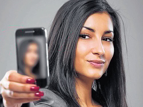 Posting too many selfies on Facebook may alienate friends, family members and colleagues, scientists say. DH Photo For Representation