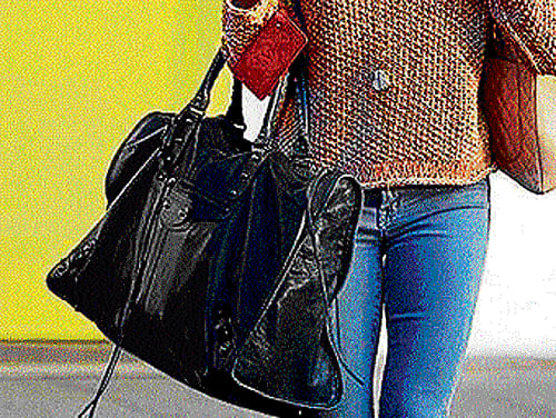 Beware: High heels and oversized bags can lead to cervical pain and other health hazards.