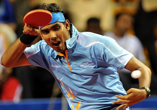On a day when India got a bagful of medals, Sharath Kamal and company kept the country's hopes alive in table tennis as the men's and women's team paddlers won their respective preliminary round matches in the 17th Asian Games, here today. DH file photo