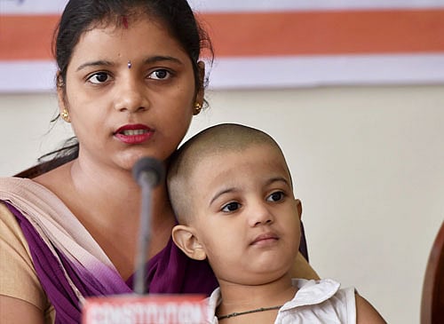 3yr-old Jahnvi with her mother at a press conference in New Delhi on Tuesday. Jahnvi, who went missing from India Gate last week was found in West Delhis Janakpuri area on Sunday, Oct 5, 2014.. PTI Photo