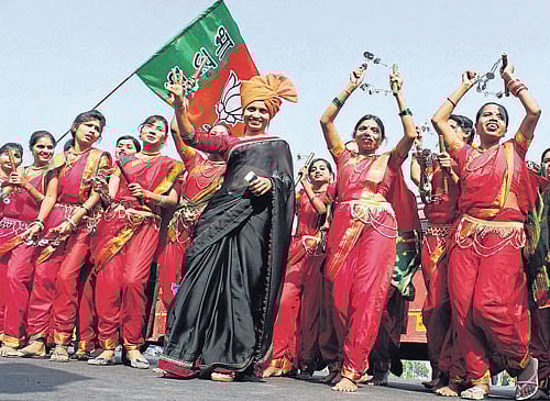 Supporters celebrate during the rally of Maharashtra Chief Minister Devendra Fadnavis in Nagpur on Sunday. PTI