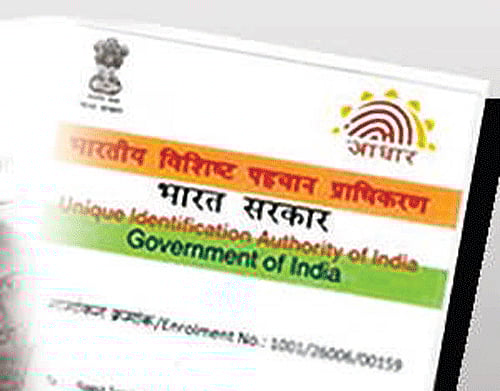 In order to extend the use of Aadhaar number to various social welfare schemes, government has asked the Unique Identification Authority and the National Population Register to complete the enrolment of the entire population by March. DH file photo