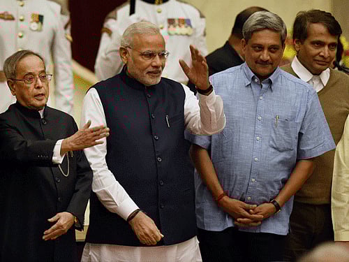 President Pranab Mukherjee, Prime Minister Narendra Modi and newly sworn-in minister Manohar Parrikar at the swearing-in ceremony at Rashtrapati Bhavan in New Delhi on Sunday. PTI Photo