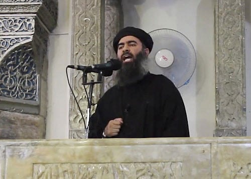FILE - This file image made from video posted on a militant website Saturday, July 5, 2014, which has been authenticated based on its contents and other AP reporting, purports to show the leader of the Islamic State group, Abu Bakr al-Baghdadi, delivering a sermon at a mosque in Iraq. On Sunday, Nov. 9, 2014, Iraqi officials and state television said al-Baghdadi has been wounded in an airstrike in western Iraq. An Interior Ministry intelligence official told The Associated Press on Sunday that the strike happened early Saturday in the town of Qaim in Iraq's Anbar province.AP